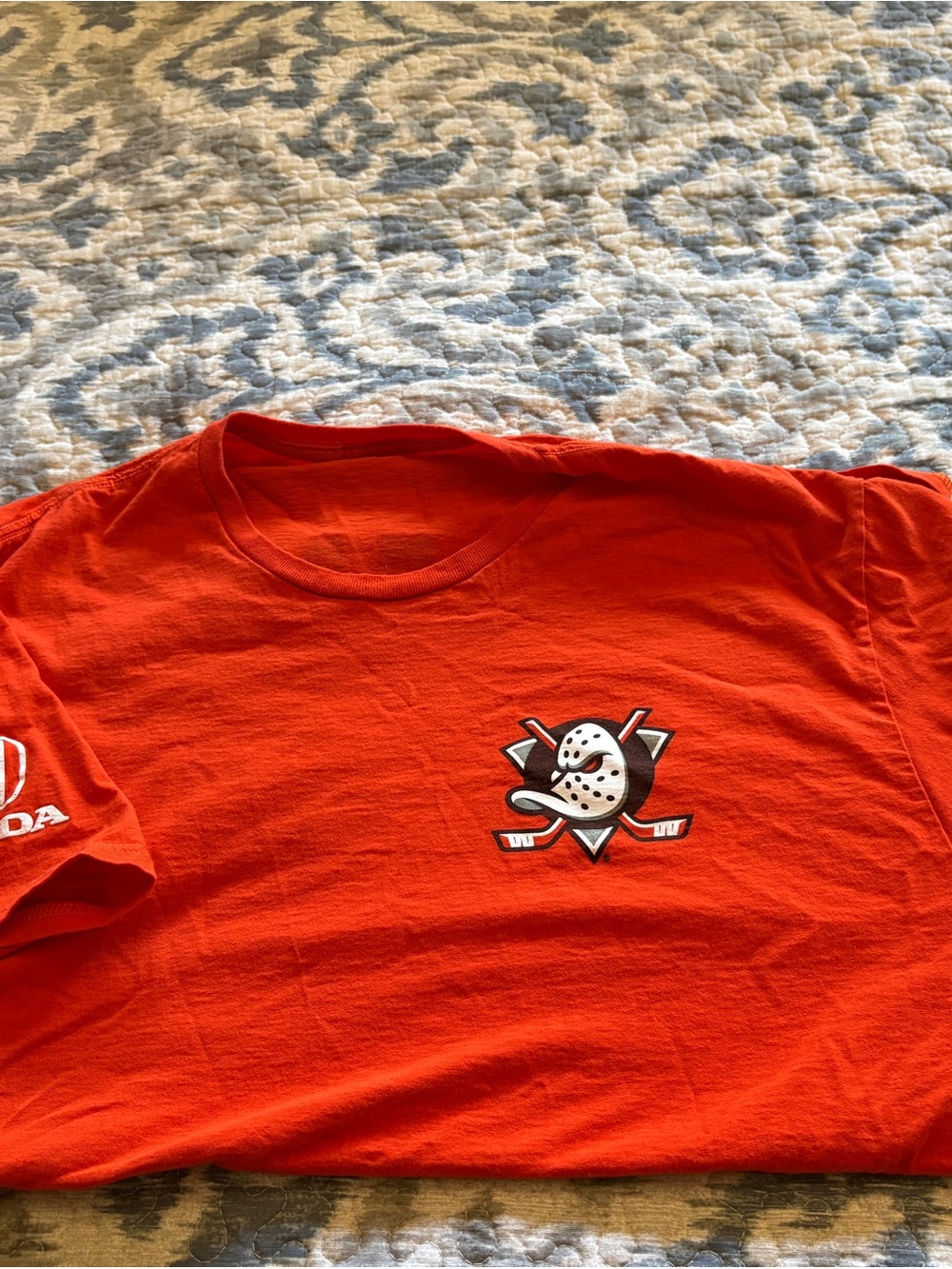 Ducks Men's Orange Short Sleeve Graphic Tee with Hockey Mask Logo
